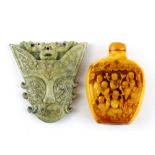 A Chinese carved bone snuff bottle together with a carved nephrite jade amulet, H. 7cm.