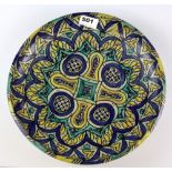 Islamic interest. North African hand painted terracotta plate, Dia. 31cm H. 7cm.
