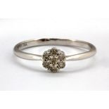 A 9ct white gold diamond set cluster ring, (Q.5).