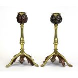 A pair of brass and copper Benson style candlesticks, H. 18cm.