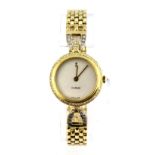 A lady's 18ct yellow gold Corum diamond set quartz wrist watch, W. 40.2g.