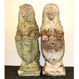 A pair of 19th Century carved sandstone garden sculptures in the shape of guardian lions holding