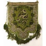 A 19th Century beadwork shield shaped panel and a group of Eastern fabric items.