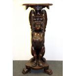 A superb 19th Century carved oak figural pedestal with lions paw feet and a winged satyr, H. 109cm.