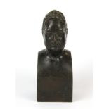 A small early 19th Century bronze bust, H. 14cm.