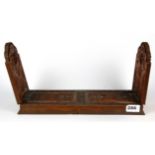 A 19th Century Chinese carved wooden sliding book rack, L. 34cm.