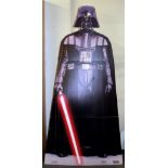 A folding cardboard Star Wars 2012 Darth Vader figure, H. 200cm.
