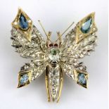 A yellow and white metal (tested high carat gold) butterfly shaped brooch / pendant, set with old