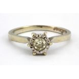 A 9ct white gold solitaire ring set with a brilliant cut white spinel, (M.5).