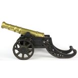 A brass and cast iron cannon, L. 46cm.