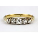 A boxed 18ct yellow gold (worn stamp 18ct) graduated brilliant cut diamond set ring, (P.5).