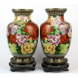 A pair of Chinese cloisonne vases on carved wooden stands, H. 30cm.