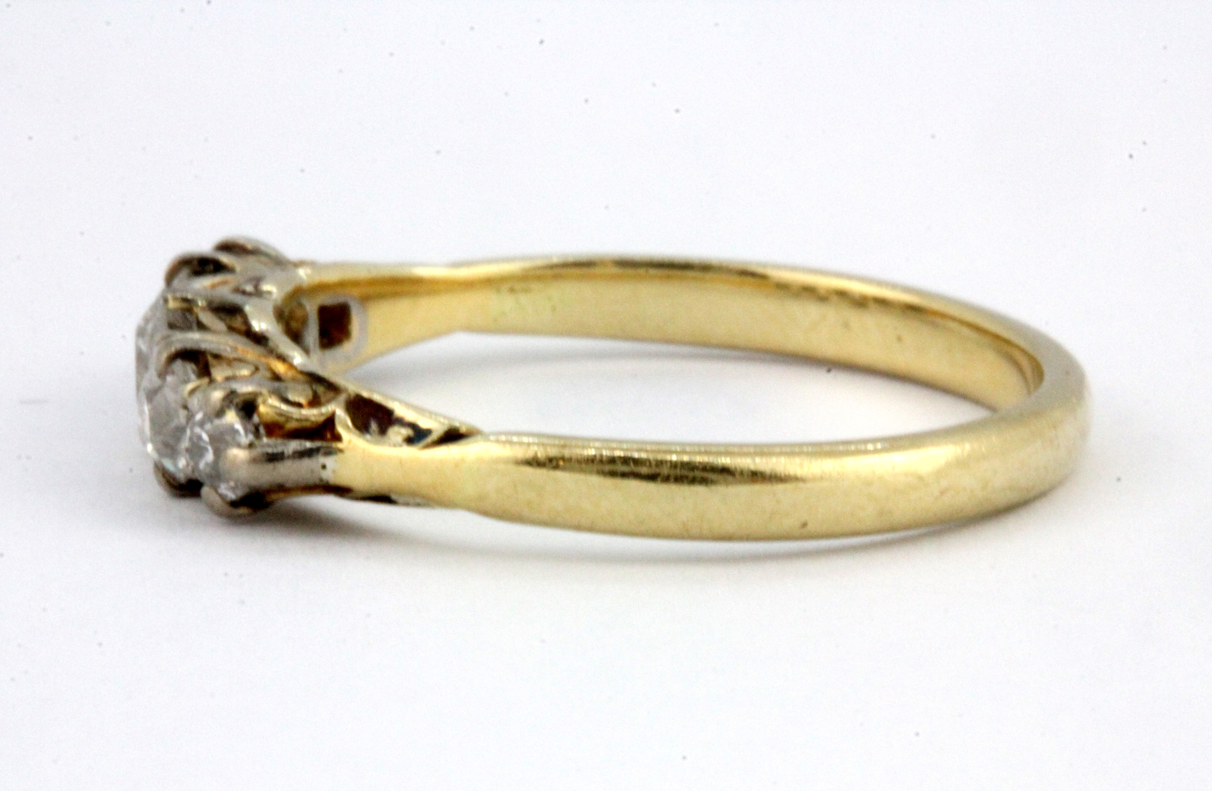 A boxed 18ct yellow gold (worn stamp 18ct) graduated brilliant cut diamond set ring, (P.5). - Image 2 of 3