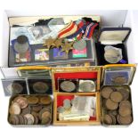 A box of coins, stamps and medals.