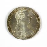 A 1780 silver Maria Theresa thaler coin.