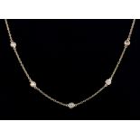 An 18ct rose gold (stamped 750) Diamond by the Yard style necklace set with brilliant cut