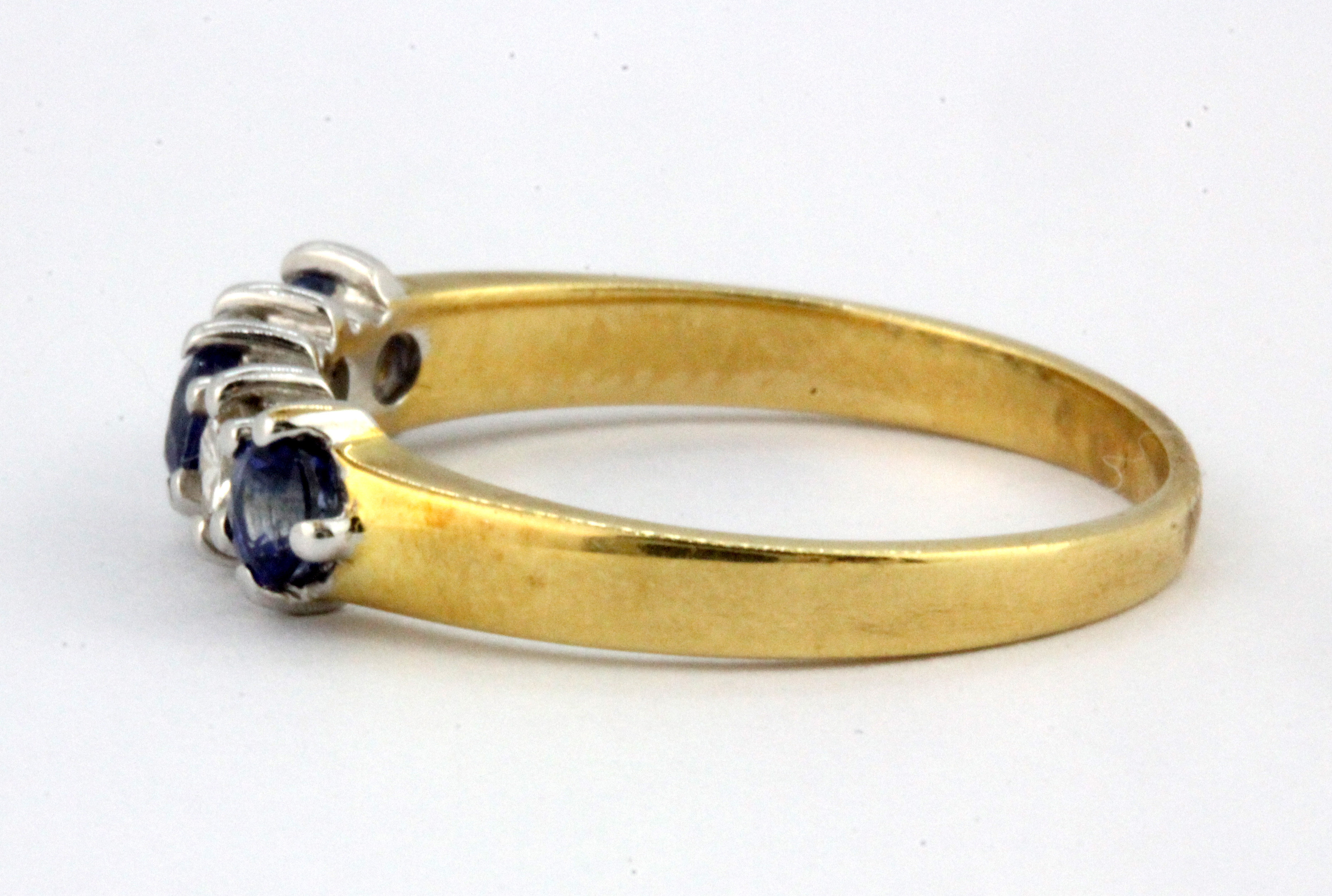 An 18ct yellow gold sapphire and diamond set half eternity ring, (M). - Image 2 of 2