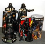 A group of boxed Star Wars collector's Darth Vader figures.