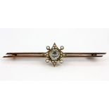 A 9ct yellow gold aquamarine and seed pearl set bar brooch, L. 6.5cm.