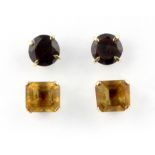 Two pairs of yellow metal (tested 9c gold) garnet and citrine set stud earrings, (with yellow