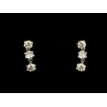 A pair of 900 platinum drop earrings set with brilliant cut diamonds, approx. 1ct overall, L. 1cm.