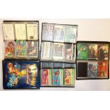 Four albums of collectors phone cards and Pokemon trading cards.