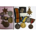 A box of mixed medals and badges including medals for S S. 115379 J. Phillips, STO. 2 R.N, 15650