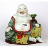 A mid 20th Century Chinese hand enamelled porcelain figure of the happy Buddha holding ruyi, H.