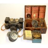 A military box, field telephone, compass and other items.