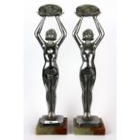 A pair of original Art Deco chromium plated figures of young women signed Limousin, H. 37cm.
