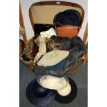 A quantity of vintage furs, bags and hats.