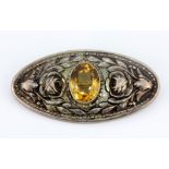 An 800 silver brooch set with a large oval cut citrine, L. 6.5 x 3cm.