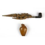 An early 20th Century carved dragon opium pipe and opium box, pipe L. 28.5cm.