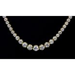 An 18ct yellow gold (stamped 750) brilliant cut diamond set graduated necklace, L. 40cm.