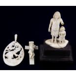 A group of three 19th and early 20th Century European carved ivory items, cross H. 5.5cm.