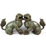 A pair of Chinese cloisonne enamel on bronze lion dog figures, H. 27cm.