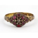 An antique 14ct rose gold ruby and diamond set cluster ring, (K).