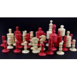 A 19th Century turned bone chess set, king H. 9.5cm. A/F too one knight.
