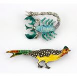 A sterling silver enamelled and marcasite set bird shaped brooch, together with a similar white