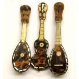 Three miniature tortoise shell veneered instruments, L. 15cm.