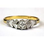 An 18ct yellow and white gold (stamped 18ct) brilliant cut diamond set ring, (Q).