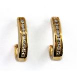 A pair of 9ct yellow gold diamond channel set earrings, L. 1.7cm.