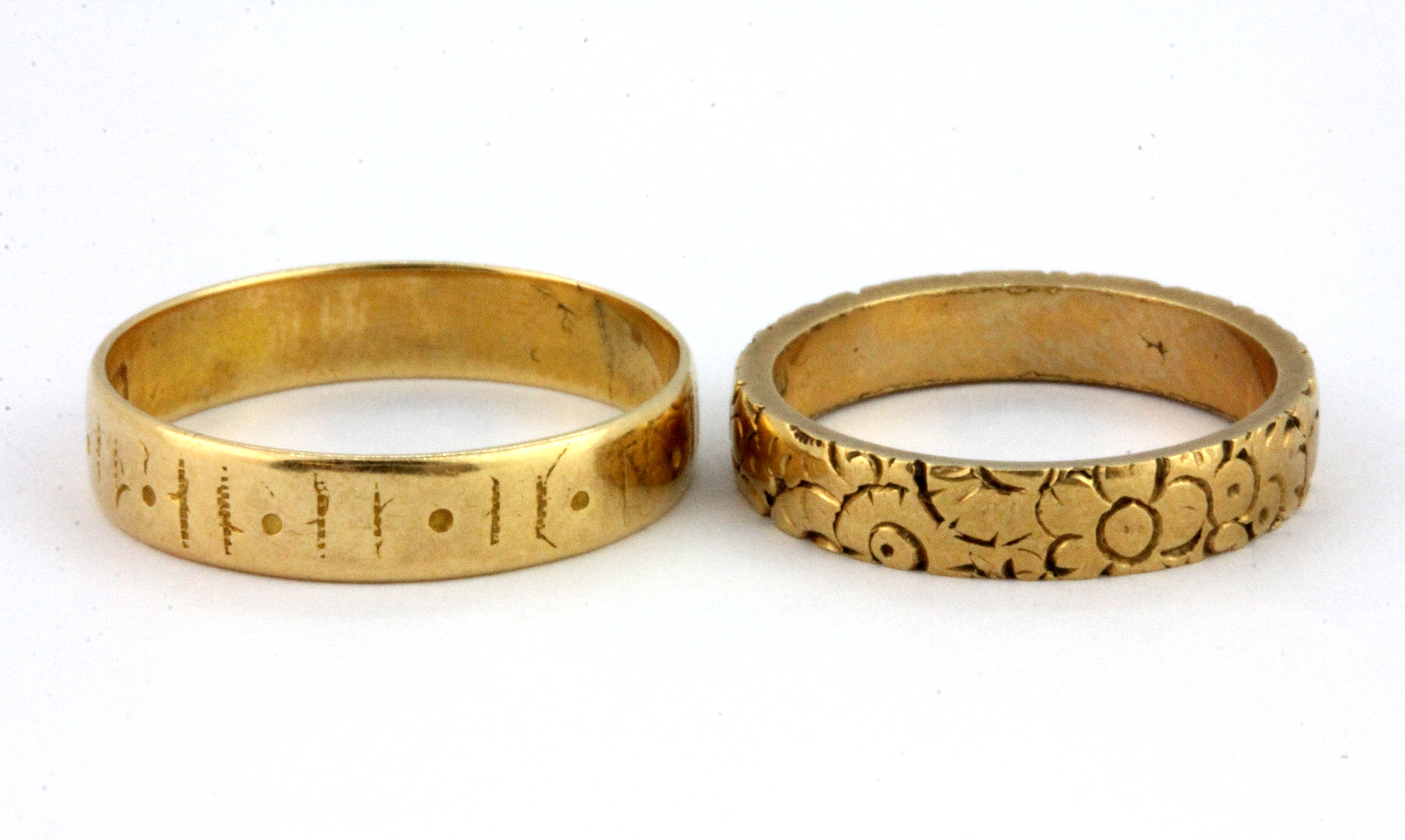 Two 18ct yellow gold patterned rings, (L &P), W. 6.4g.