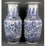 A pair of 19th Century Chinese hand painted porcelain vases, H. 46cm.