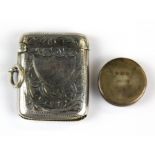A hallmarked silver vesta case and a small silver patchbox.