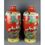 A pair of impressive large early-mid 20th Century Chinese relief decorated porcelain vases, both