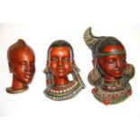 Three 1950's /60's Achatit African head ceramic wall plaques, largest 23cm.