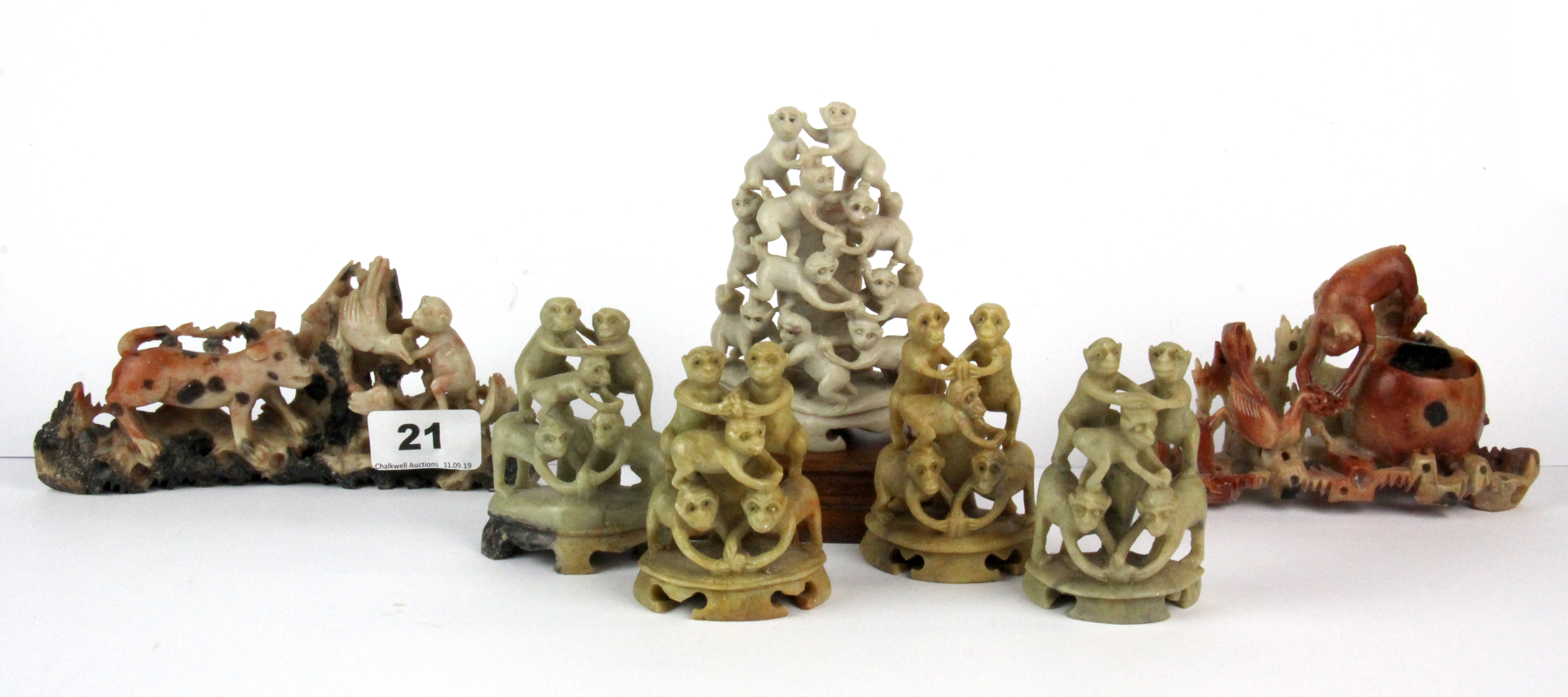 A group of seven Chinese carved soapstone monkeys, tallest H. 11cm.