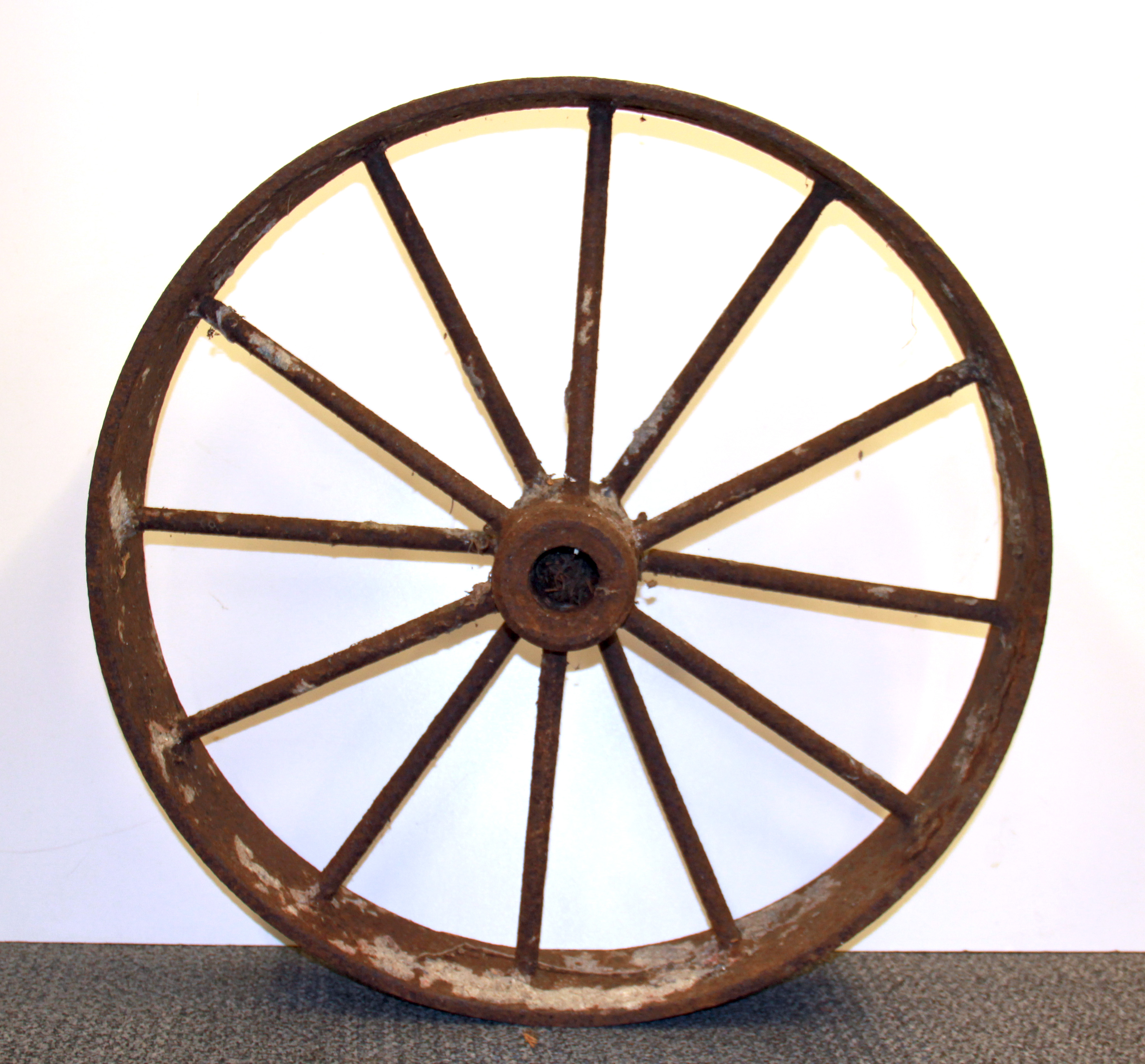 An antique wide rim iron wheel, Dia. 61cm.