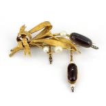 A yellow metal (tested high carat gold spray brooch set with pearls, garnets and diamonds, L. 6.5cm,